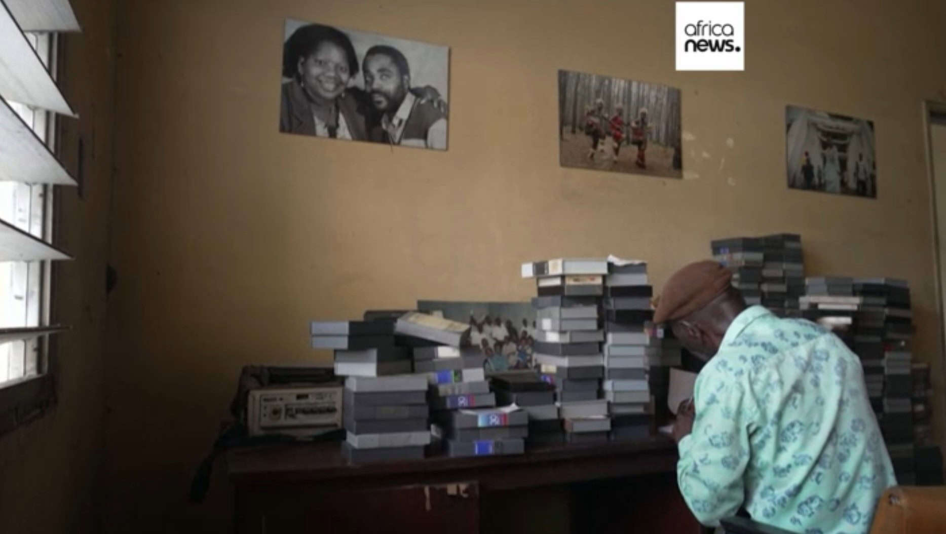 Volunteers sorting and organizing old TV archives in Congo for preservation.