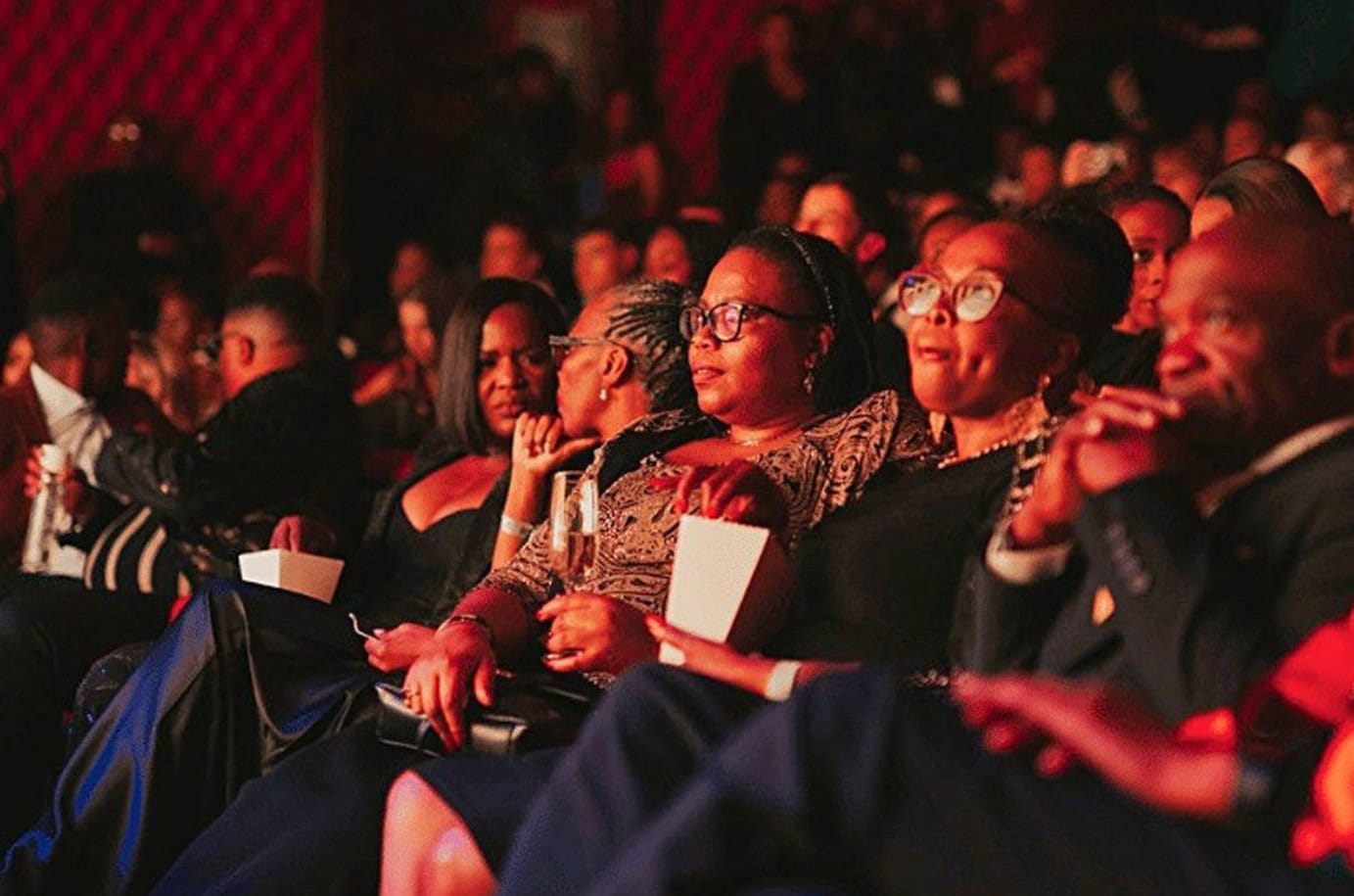 Audience watching a film at the Joburg Film Festival showcasing African cinema.