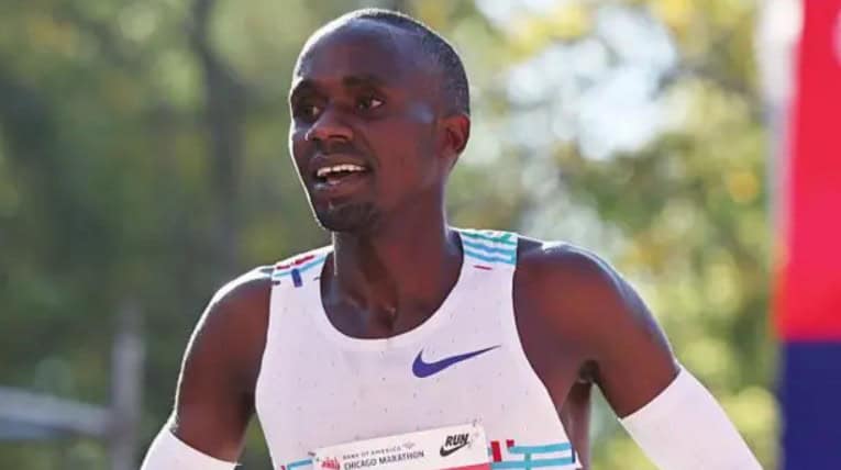 Jacob Kiplimo running during a race, showcasing his athletic achievement.