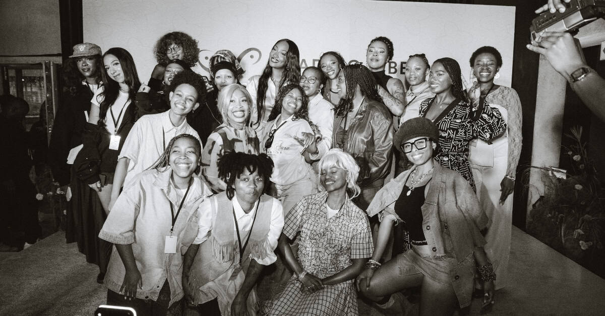 Group of women celebrating at Tems’ Leading Vibe Initiative in South Africa.