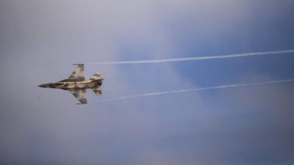 Moroccan fighter jet flying at high speed during military exercise.