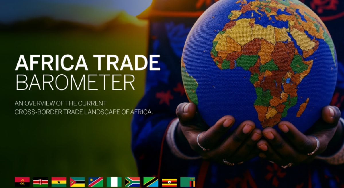 Hand holding a globe of Africa highlighting trade and infrastructure development.
