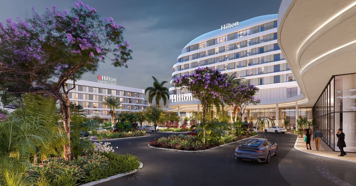 Modern Hilton hotel in Africa with lush landscaping and luxury amenities.