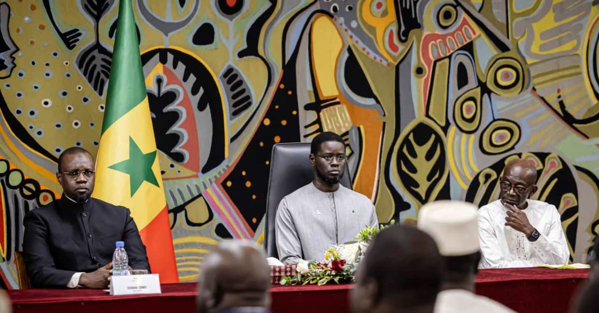 Senegal officials discuss debt transparency issues at a formal meeting.