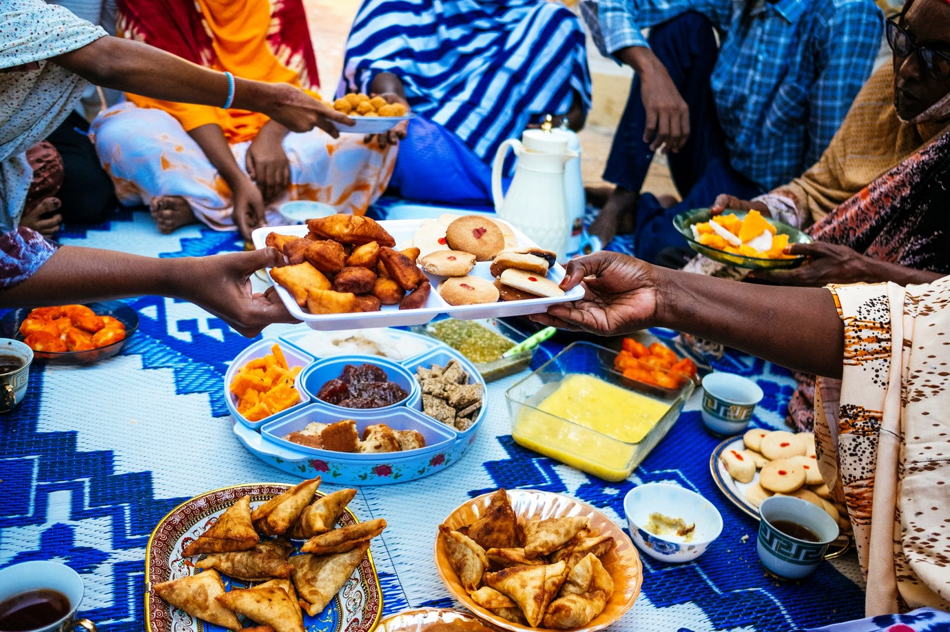 Traditional African food sharing during a community event in Africa.
