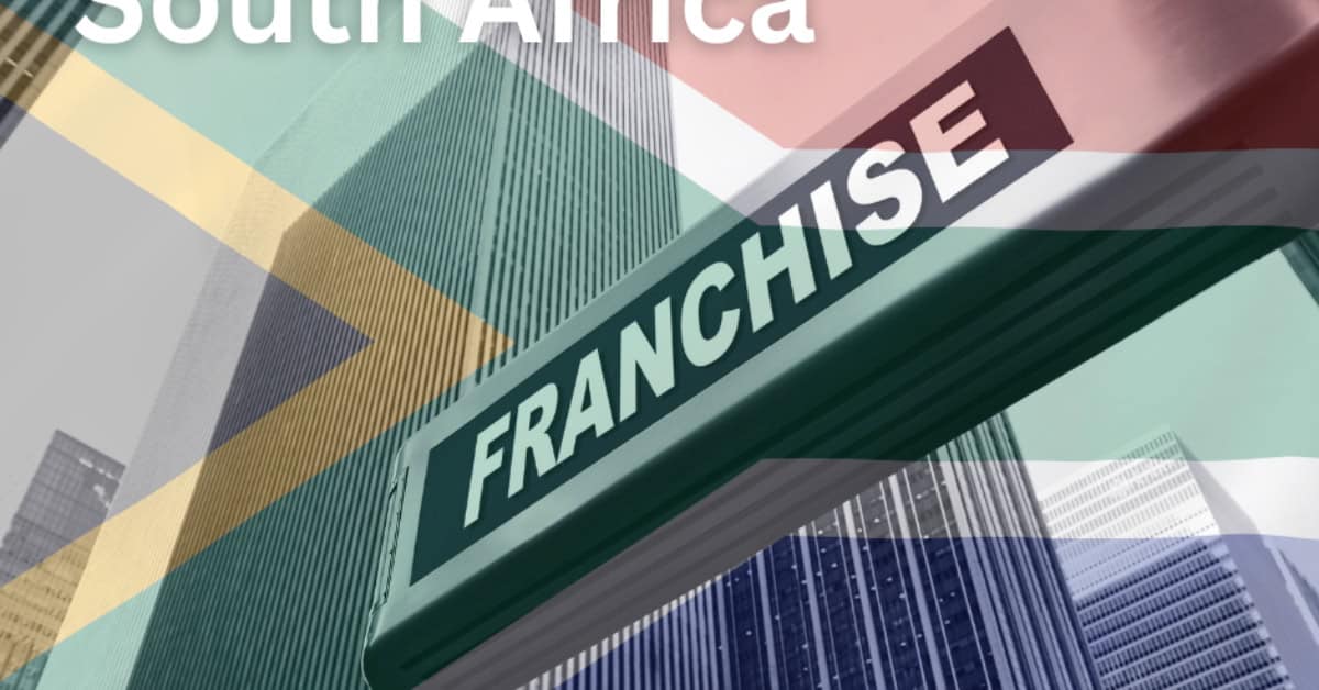 Modern skyscrapers with a South Africa franchise sign in the city center.