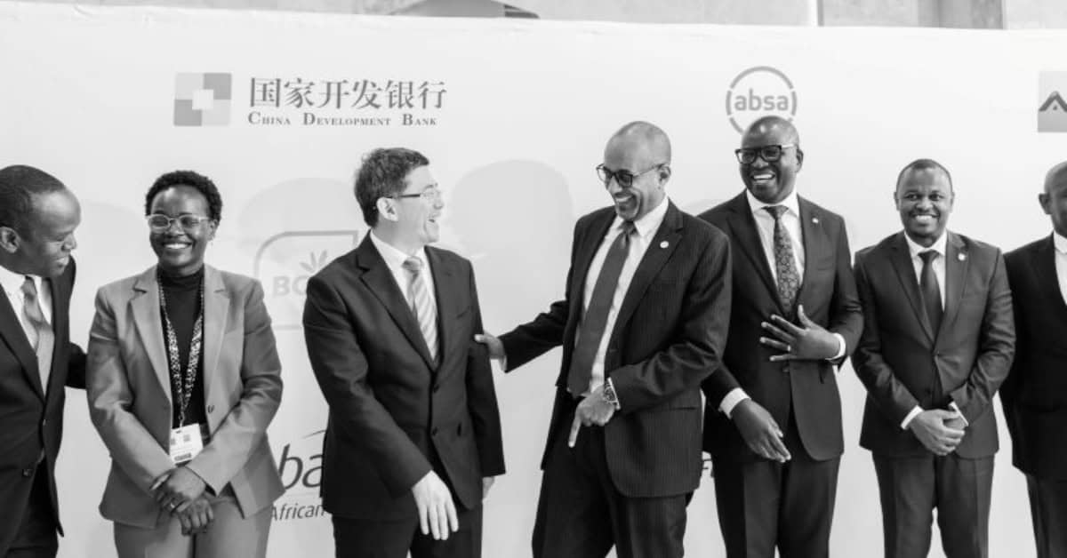 Senior officials shaking hands at China-Africa development finance event in Nairobi.