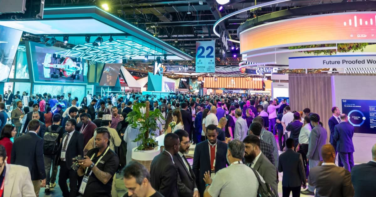 Business professionals networking at Africa-focused tech conference.