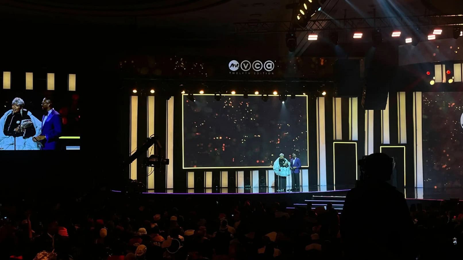 Stage scene at 2026 AMVCAs with presenters and audience in attendance.