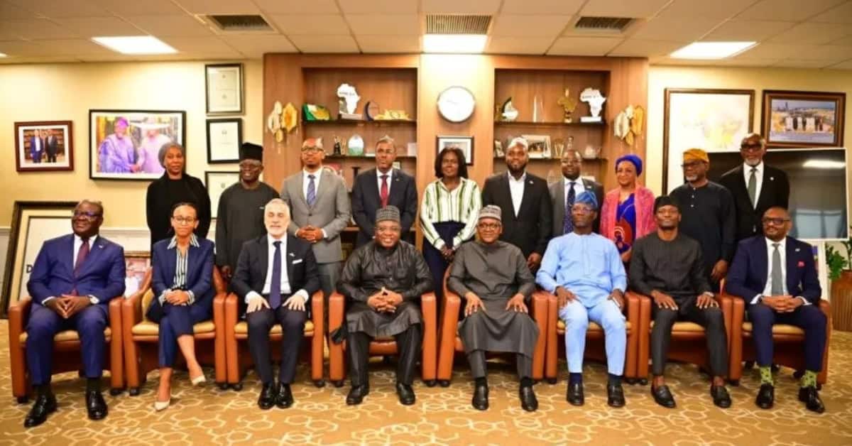 Group of African stock market officials discussing financial integration and wealth creation.