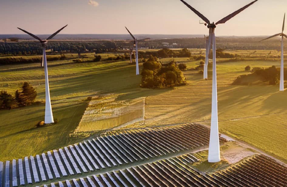 Renewable energy farm with wind turbines and solar panels in Africa.
