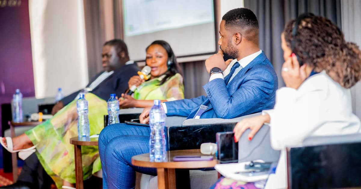 Business professionals at DRC Investment Forum discussing energy solutions.