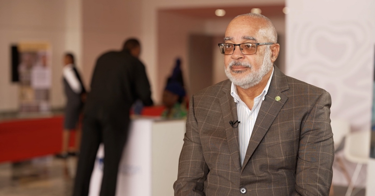 Didacus Jules speaking at an event about Africa's development and connectivity.