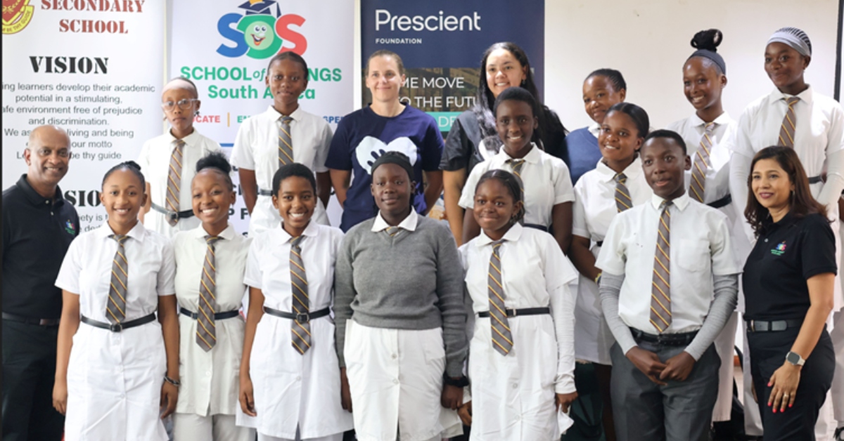 Group of diverse secondary school students in uniform at school event.