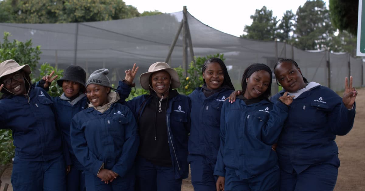 Young women participating in youth-led micro-farming initiative in Africa.