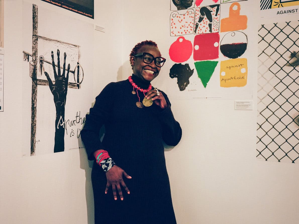 Colorful African-inspired artwork and cultural symbols in a gallery setting.