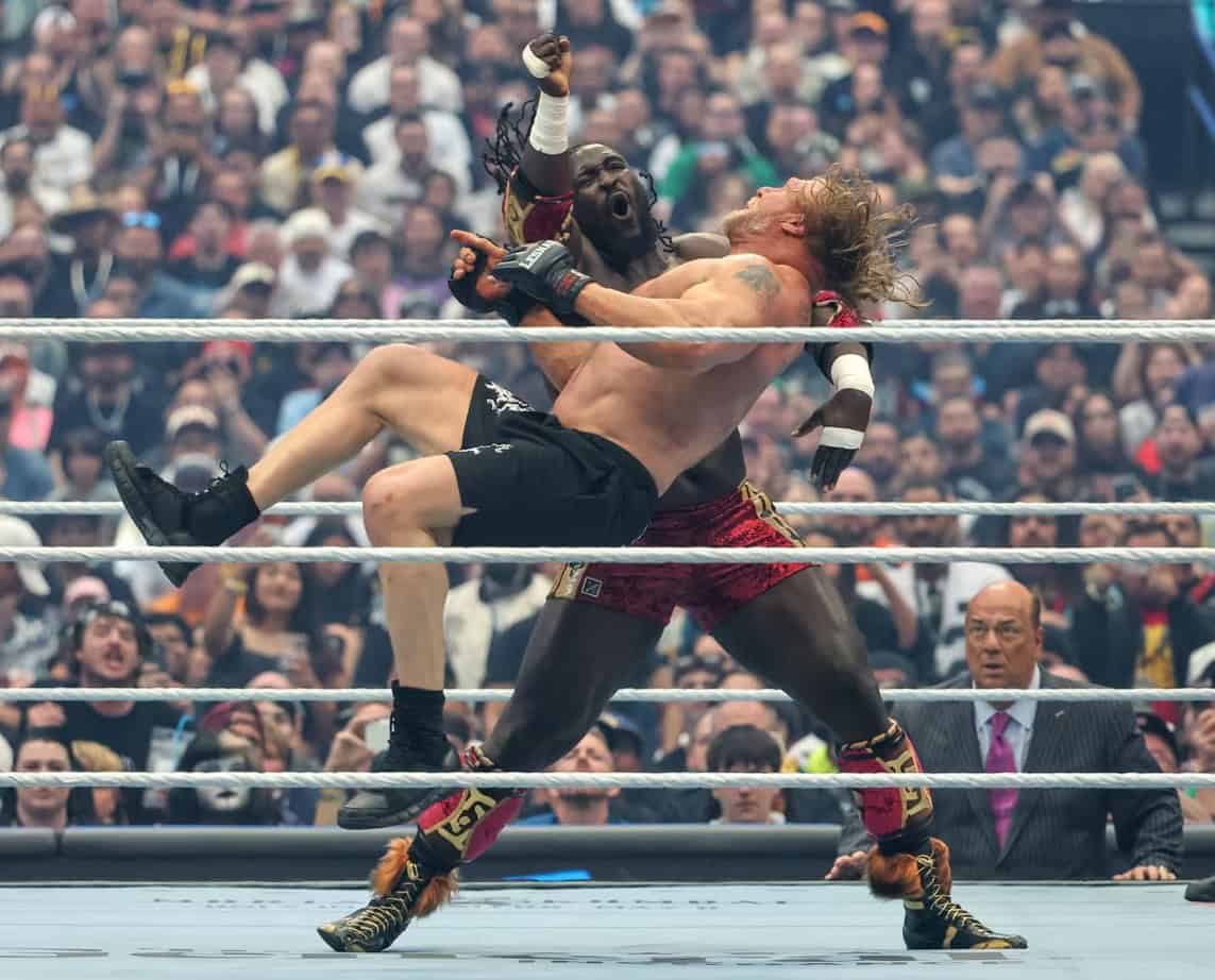 Intense wrestling move between two athletes during a match.