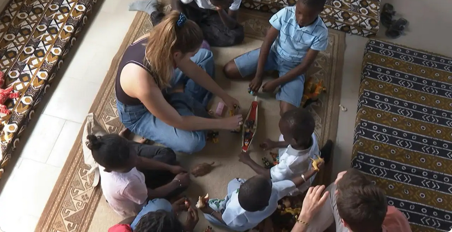Children playing with toys and engaging in activities indoors.
