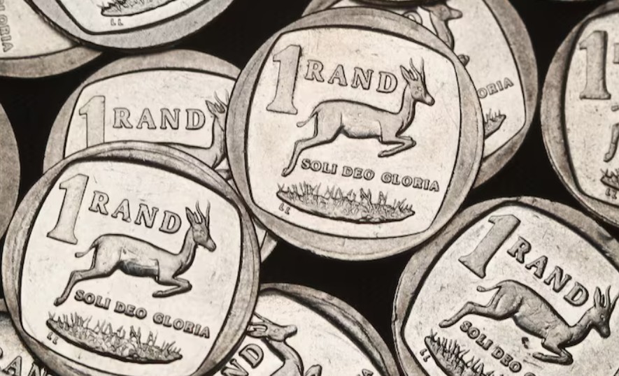 Close-up of Rwandan one franc coins featuring a gazelle.