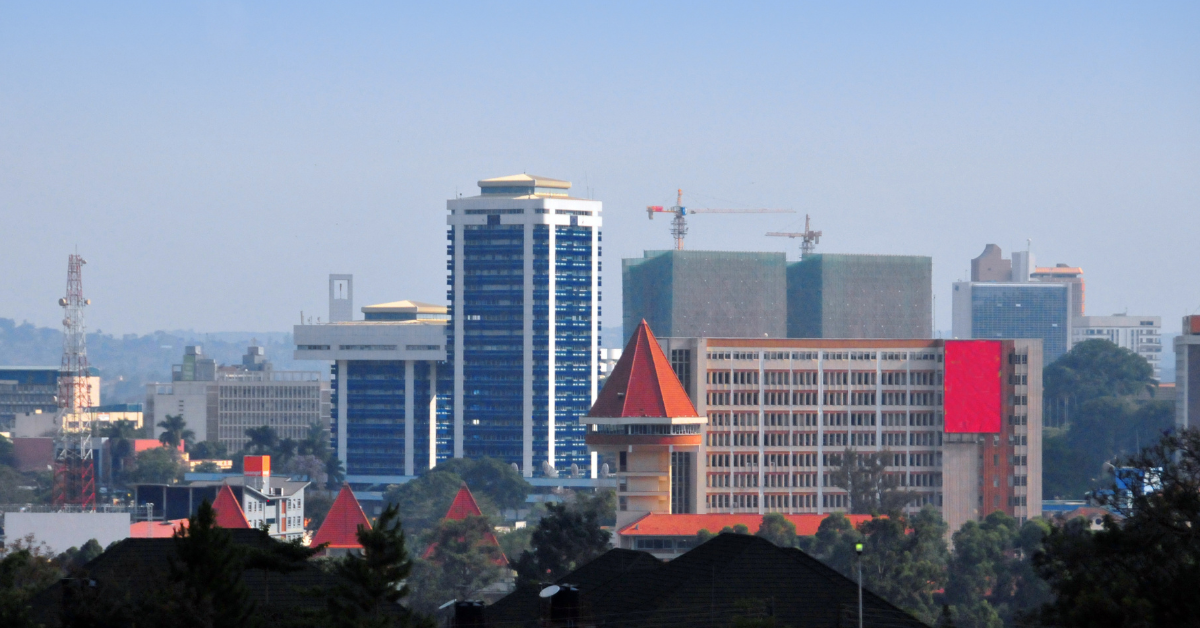 Cityscape of Kampala with high-rise buildings and red-roofed structures in Uganda.