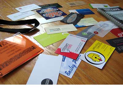 Pile of business cards on a table.