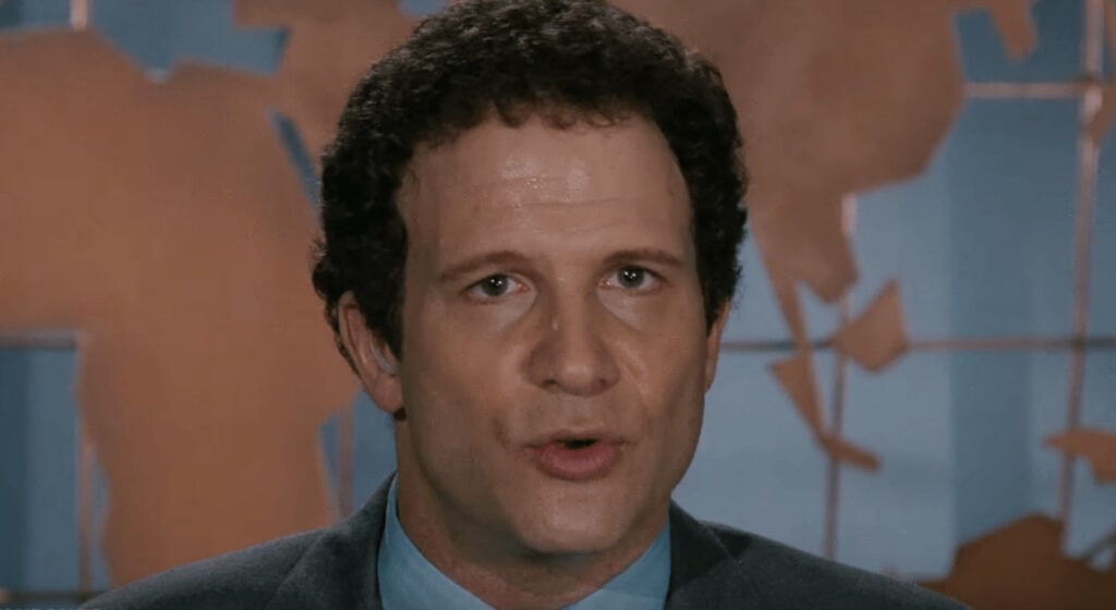 Movie still from the movie Broadcast News featuring Al Brooks.