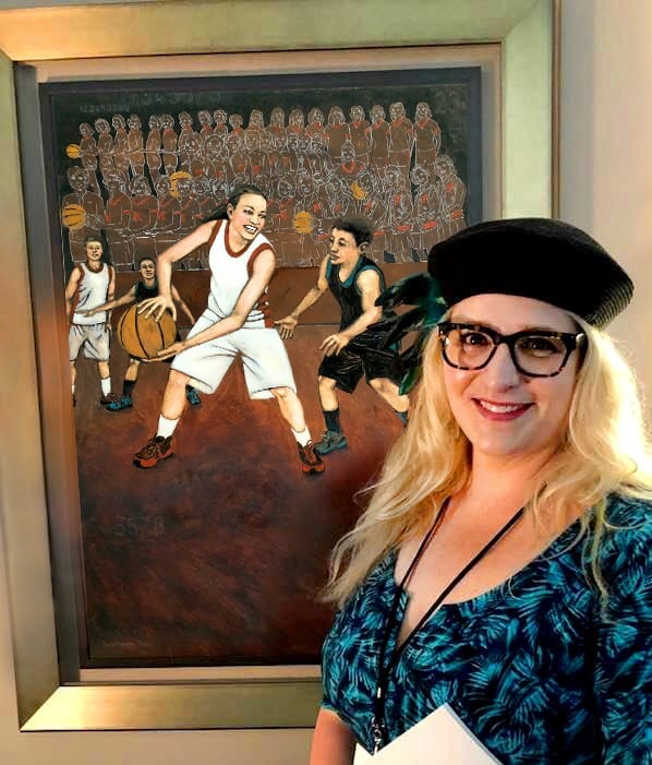 Rochelle W. Carr standing in front of her painting at the Fiserv Forum.