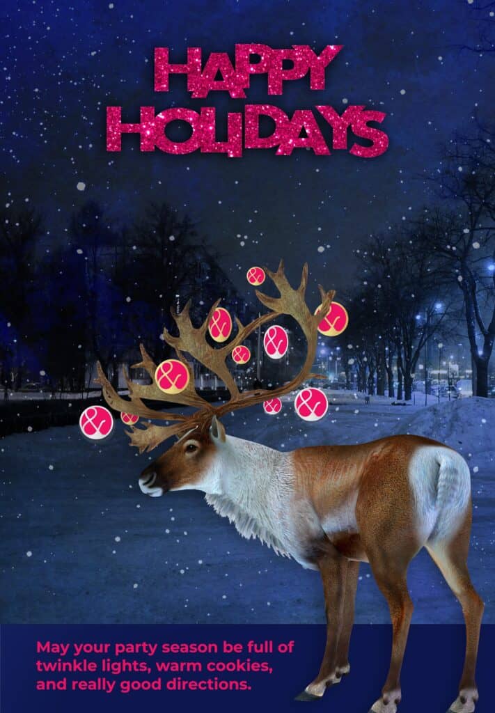 Happy Holidays graphic featuring a stag with ornaments hanging from its antlers