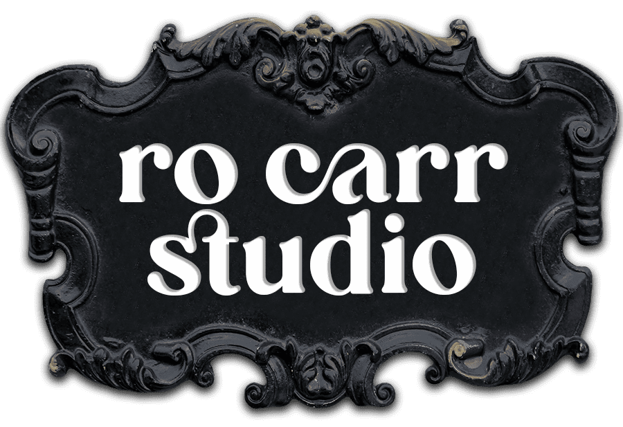 Ro Carr Studio logo in baroque frame.
