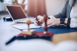 person doing online notary on laptop