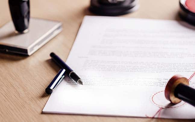incorporation documents on a table with corporate seal