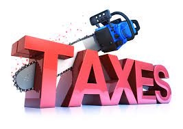 chainsaw cutting through taxes sign