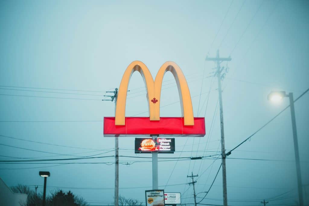 Red and white LED signage, symbolizing the concept of trademarking a logo​