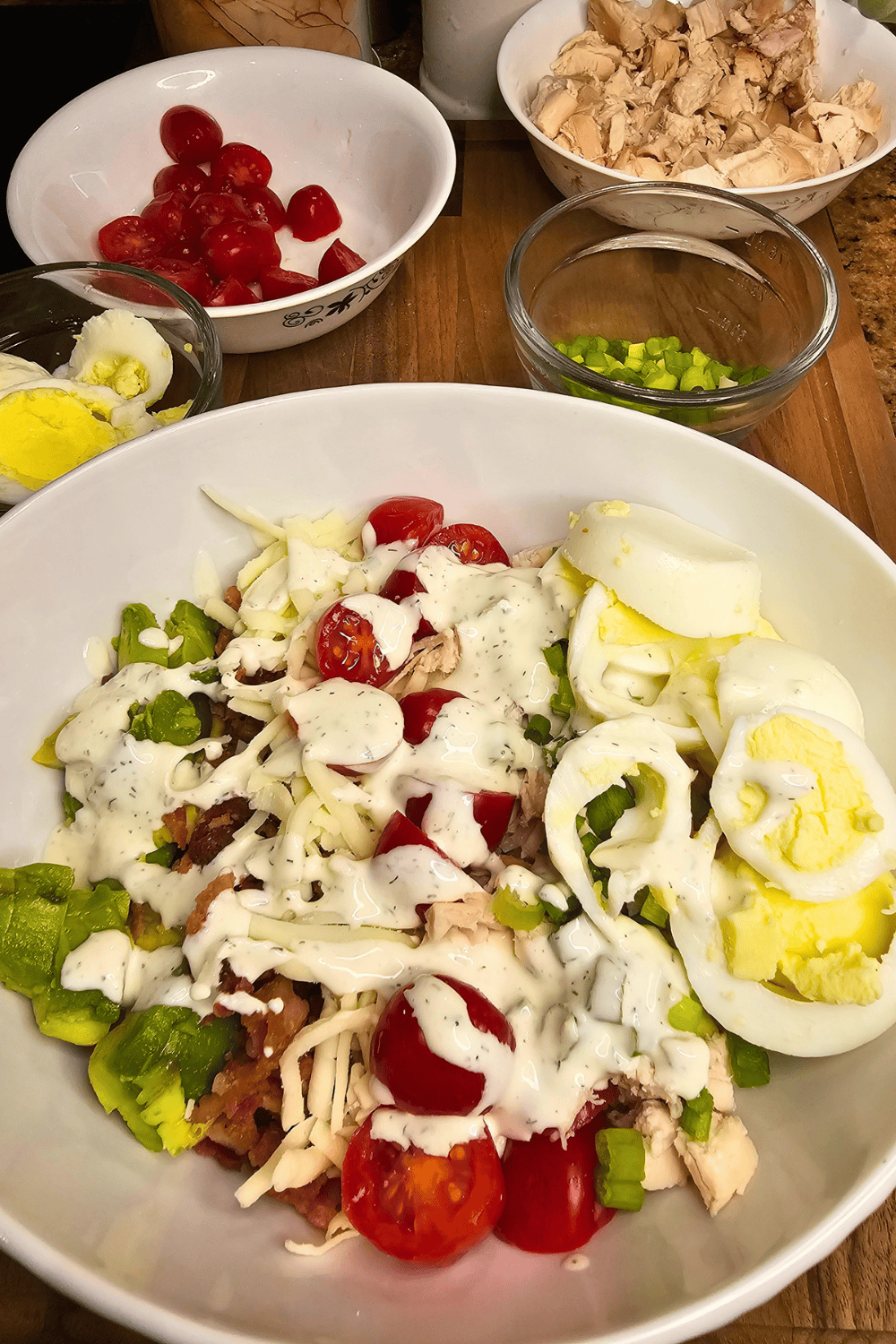 Healthy chicken salad with fresh vegetables and boiled eggs.