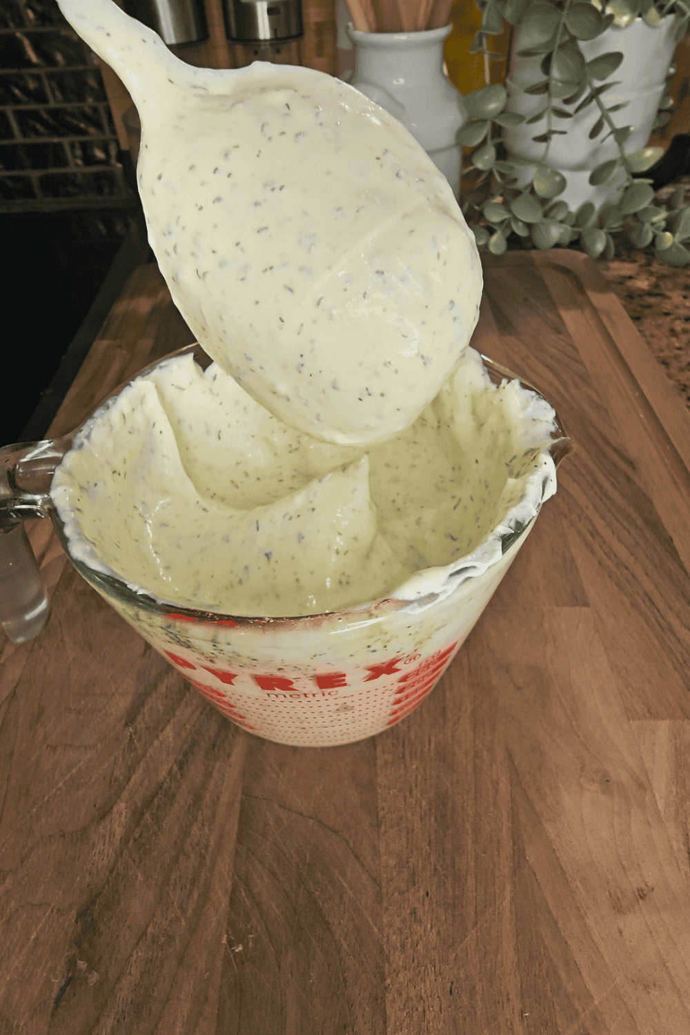 Herb-infused creamy dip served in a bowl, perfect for healthy snacks and meal prep.