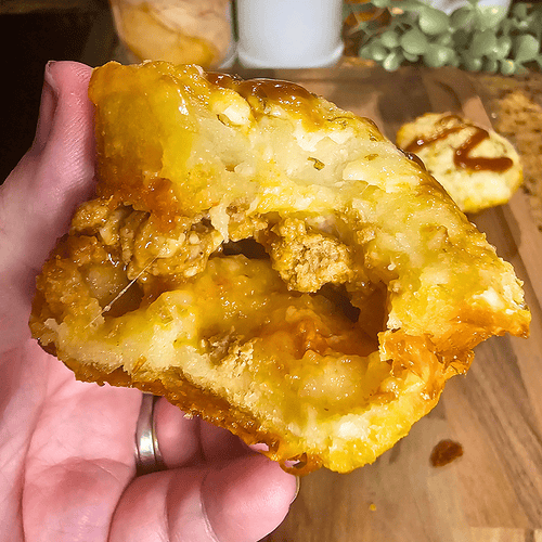 Close-up of a Sloppy Joe Muffin with melted cheese and savory filling.