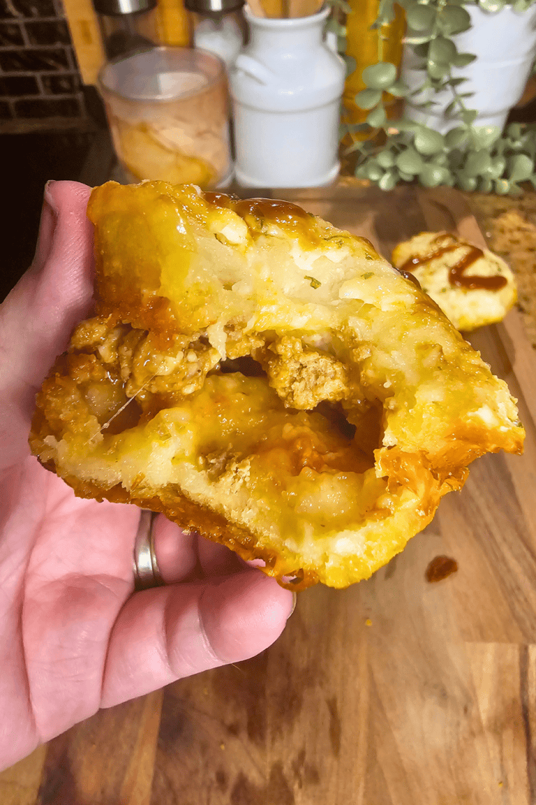 Close-up of a Sloppy Joe Muffin with melted cheese and savory filling.