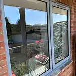 Modern double glazed window installation for improved insulation and security.