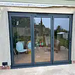 Modern grey aluminium sliding patio doors, energy-efficient glazing, for stylish home upgrades.