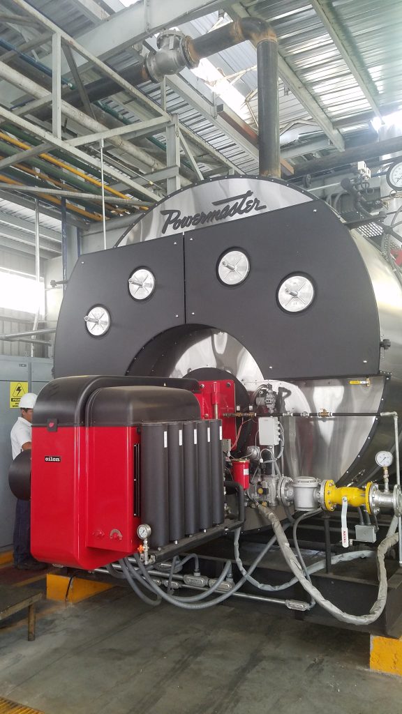 Installed Powermaster firetube steam boiler with Oilon burner, serviced by Ecowaterlab for high-efficiency industrial steam production.