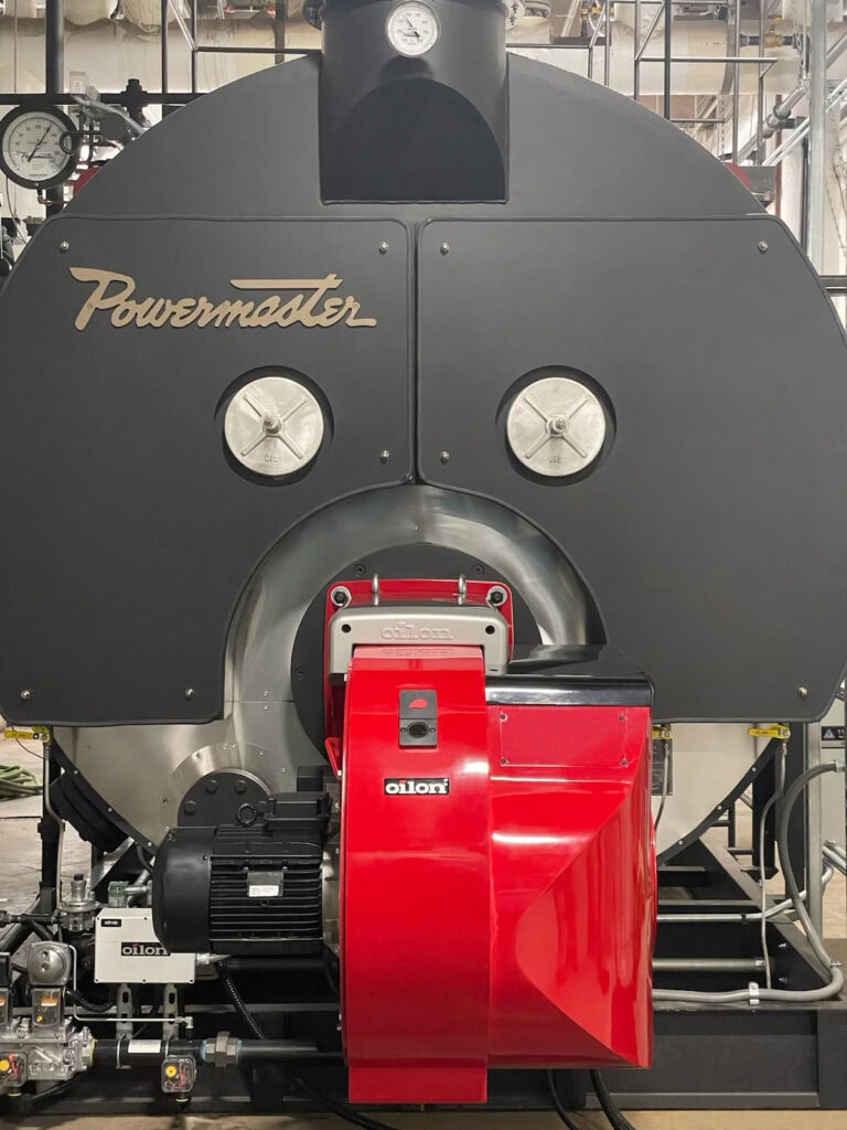 Mobile boiler rental Standalone Powermaster industrial boiler with red Oilon burner, supplied by Ecowaterlab for mobile or permanent steam applications.