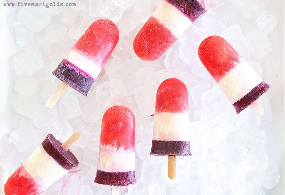 Red White and Blue Popsicles for adults using fruit, cream and your favorite wine.