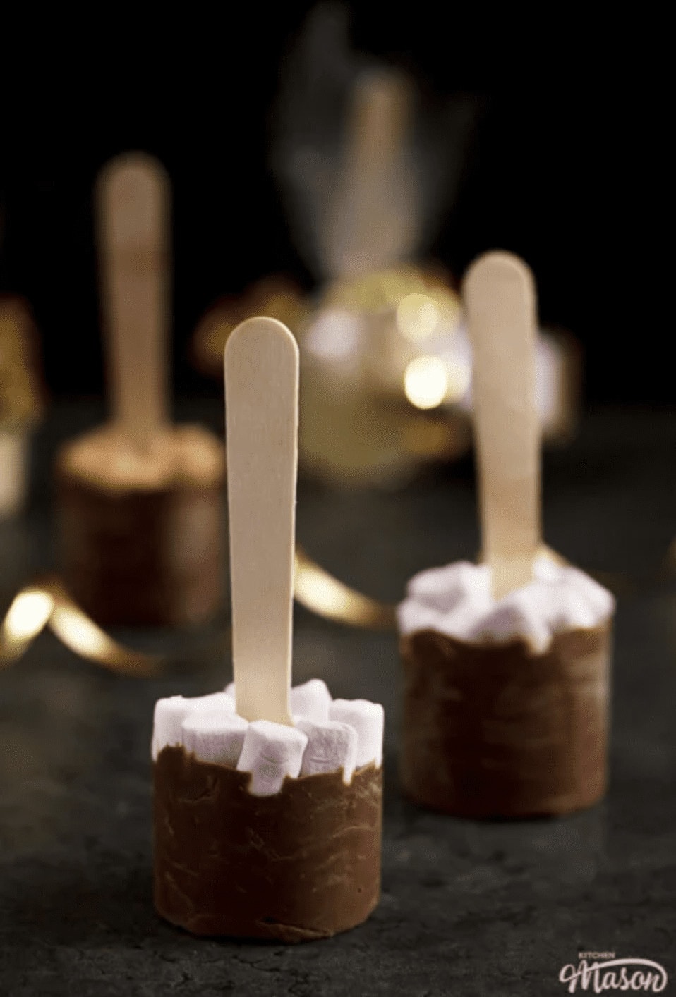 hot chocolate stirrers with marshmallows on top