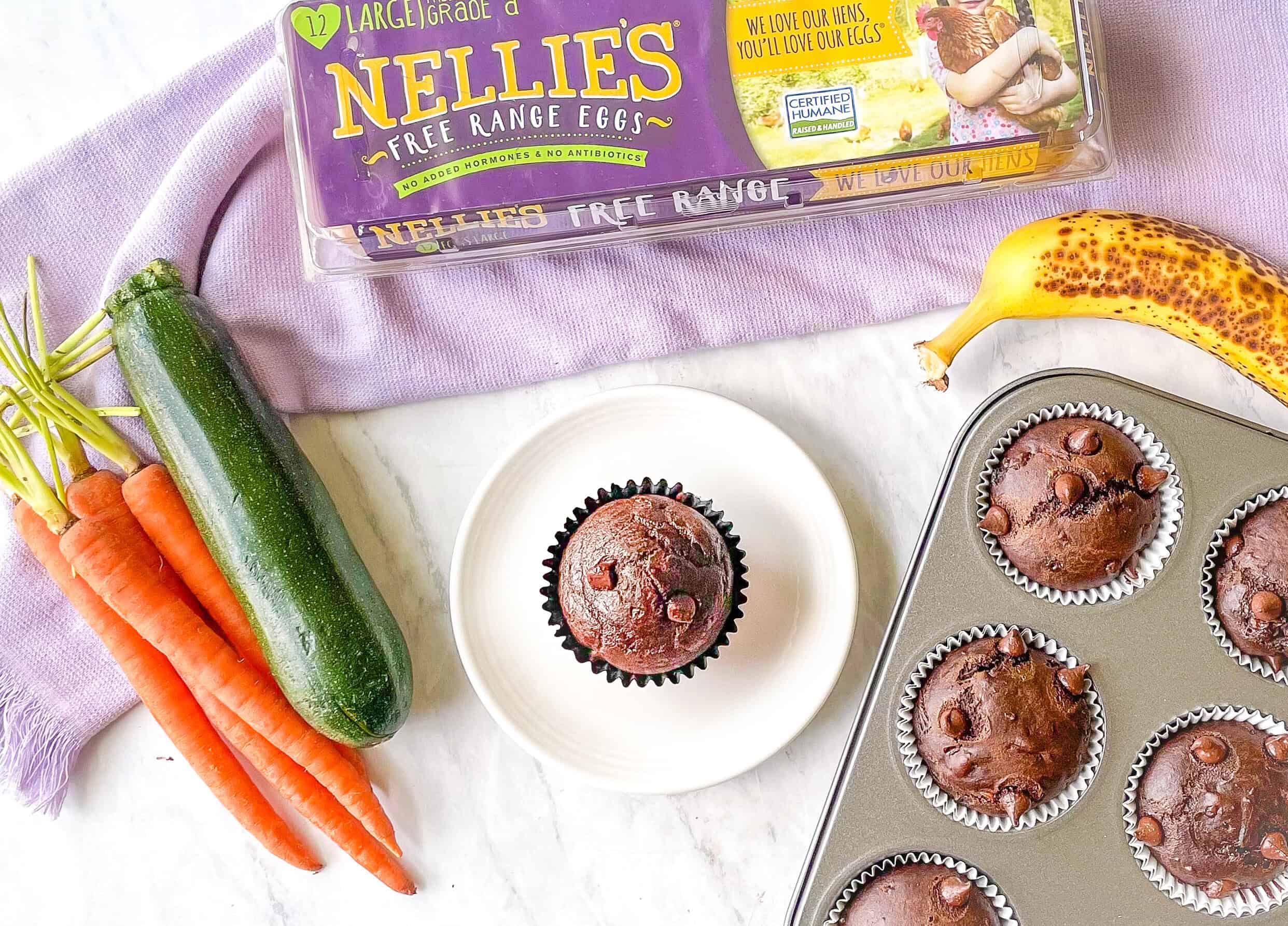 Photo of carrots, zucchini, banana and a chocolate muffin