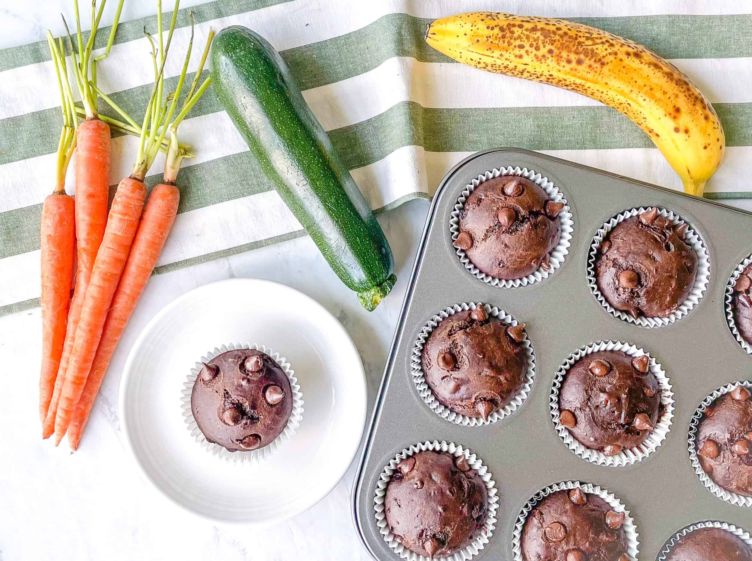 Photo of carrots, zucchini, banana and a chocolate muffin