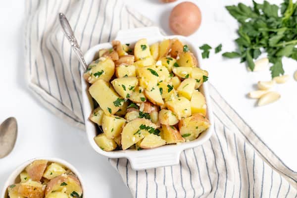 table of ingredients and perpared Italian potato salad