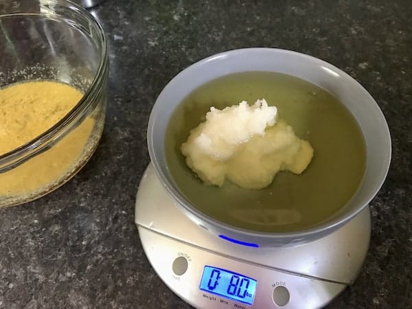 Image shows ingredients for the soap being weighed on a digital scale