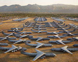 Rows of U.S. Air Force planes lined up in a field. Edward Burtynsky, Oil.