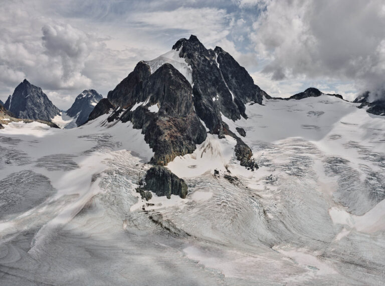 Large mountain peak rising above glacial ice and snow. Edward Burtynsky, Coast Mountain series.