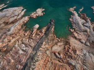 An aerial view of the lake and shore of Lake Mead in Nevada USA, 2023. Edward Burtynsky, image titled Echo Bay #1.
